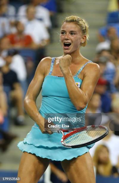 Camila Giorgi of Italy celebrates match point during her wwomen's singles third round mac against Caroline Wozniacki of Denmark on Day Six of the...