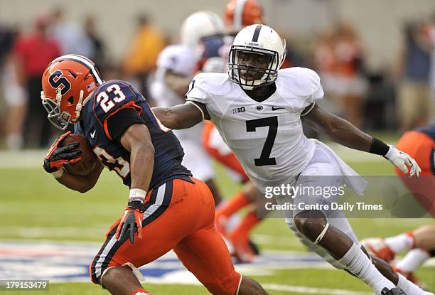 Penn State's Stephen Obeng-Agyapong tackles Syracuse's Prince-Tyson Gulley at MetLife Stadium in East Rutherford, New Jersey, on Saturday, August 31,...