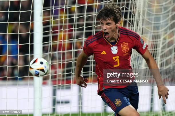 Spain's defender Robin Le Normand celebrates scoring the opening goal during the UEFA Euro 2024 group A qualifying football match between Spain and...