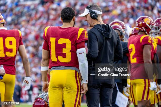 Trojans head coach Lincoln Riley talks with USC Trojans quarterback Caleb Williams during a timeout in the first half of the team's 38-20 loss to...