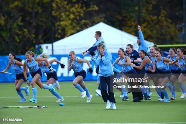 Head Coach Erin Matson of the North Carolina Tar Heels can't look after defeating the Northwestern Wildcats for the national title during the...