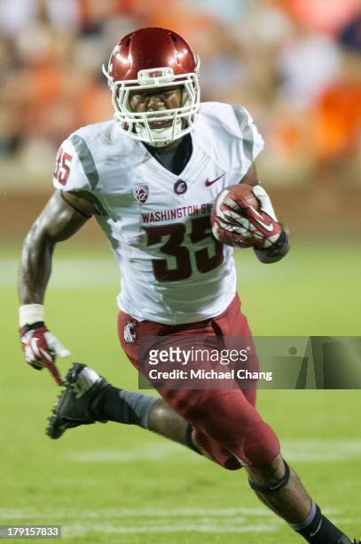 Running back Marcus Mason of the Washington State Cougars runs the ball downfield during the second half of play on August 31, 2013 at Jordan-Hare...