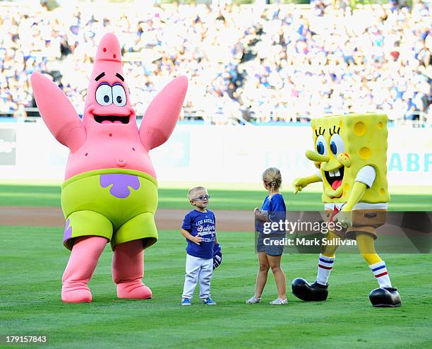 SpongeBob and Patrick on the field before the MLB game between the San Diego Padres and Los Angeles Dodgers at Dodger Stadium on August 31, 2013 in...