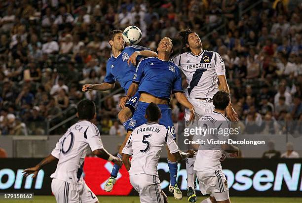 Clarence Goodson and Steven Lenhart of San Jose Earthquakes and Omar Gonzalez of Los Angeles Galaxy vie for the corner kick in the first half during...