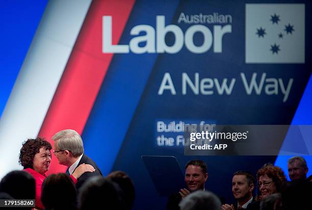 Australia's Prime Minister Kevin Rudd is embraced by his wife Therese Rein at the start of the official launch of the Labor Party's federal campaign...