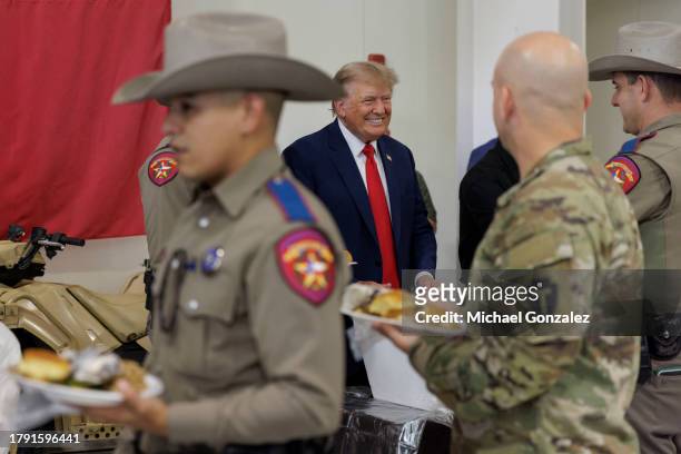 Former President Donald Trump serves meals to Texas Department of Public Safety troopers at the South Texas International airport on November 19,...