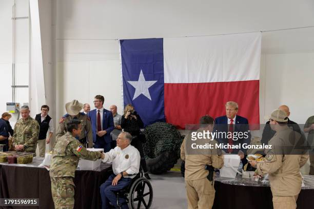 Former President Donald Trump and Texas Governor Greg Abbott serve meals to Texas Department of Public Safety troopers and Texas National Guard at...