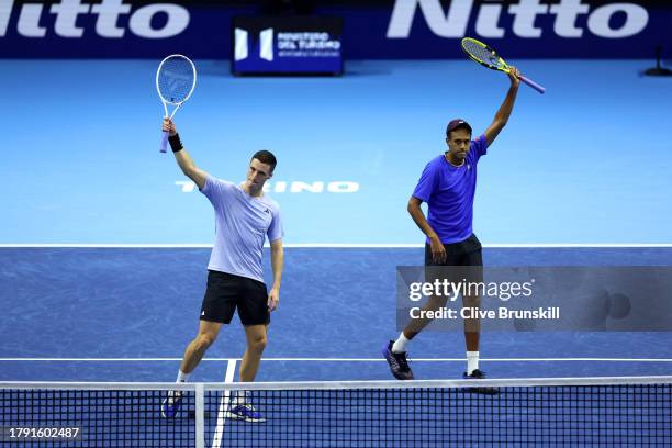 Joe Salisbury of Great Britain and Rajeev Ram of United States celebrate victory against Matthew Ebden of Australia and Rohan Bopanna of India during...