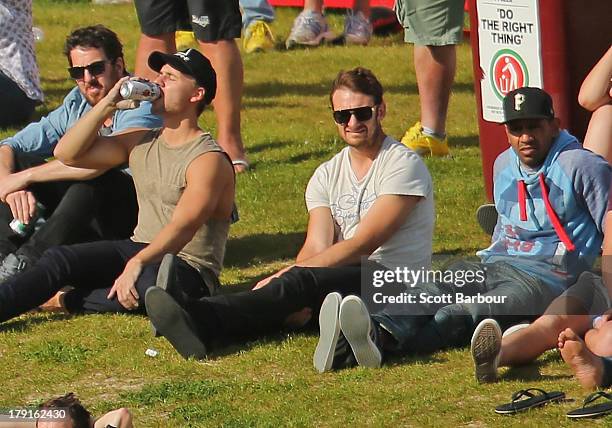 Members of the Essendon Bombers AFL team including Jobe Watson and Nathan Lovett-Murray watch from the crowd during the VFL Elimination Final match...