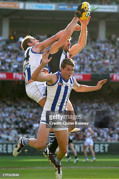 Quinten Lynch of the Magpies marks during the round 23 AFL match between the Collingwood Magpies and the North Melbourne Kangaroos at Melbourne...