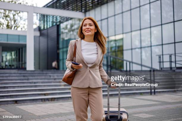 travel-ready businesswoman stays connected - business journey stock pictures, royalty-free photos & images