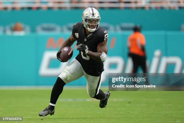 Las Vegas Raiders running back Josh Jacobs runs after a catch in the second half during the game between the Las Vegas Raiders and the Miami Dolphins...