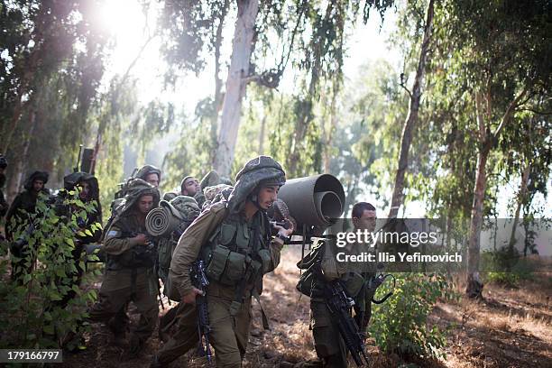 Israeli soldiers during a military exercise on September 1, 2013 near the border with Syria, in the Israeli-annexed Golan Heights. Tension's are...