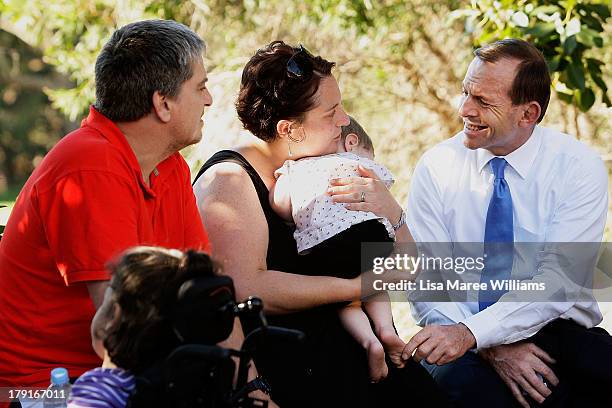 Opposition Leader Tony Abbott meets families at Bear Cottage in Sydney on September 1, 2013 in Sydney, Australia. Australian voters will head to the...