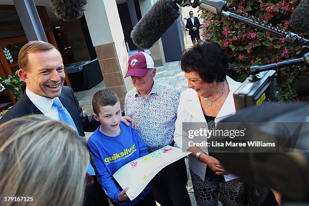 Opposition Leader Tony Abbott meets Ben Betteridge at Bear Cottage in Sydney on September 1, 2013 in Sydney, Australia. Australian voters will head...