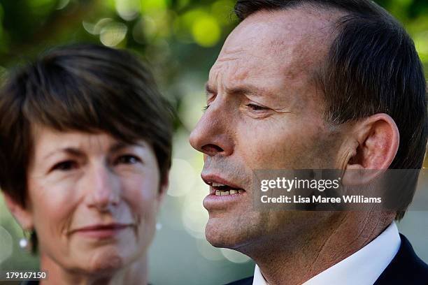 Opposition Leader Tony Abbott speaks to the media as wife Margie Abbott looks on at Bear Cottage in Sydney on September 1, 2013 in Sydney, Australia....