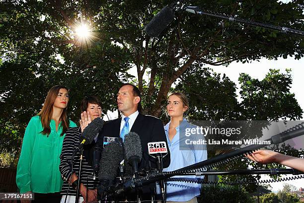 Opposition Leader Tony Abbott speaks to the media as his family, Frances, Margie and Bridget look on at Bear Cottage in Sydney on September 1, 2013...