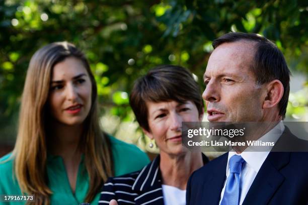 Opposition Leader Tony Abbott speaks to the media as daughter Frances and wife Margie look on at Bear Cottage in Sydney on September 1, 2013 in...