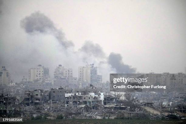 Smoke rises over northern Gaza and destroyed buildings on November 13, 2023 viewed from Sderot, Israel. More than month after Hamas's Oct. 7 attacks,...