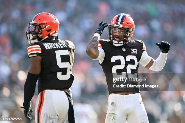 Grant Delpit and Anthony Walker Jr. #5 of the Cleveland Browns celebrate a pass breakup by Walker during the second half against the Arizona...