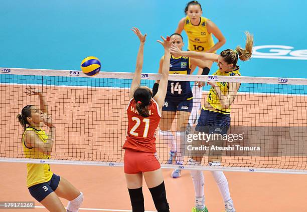 Thaisa Menezes of Brazil spikes the ball during day five of the FIVB World Grand Prix Sapporo 2013 match between China and Brazil at Hokkaido...
