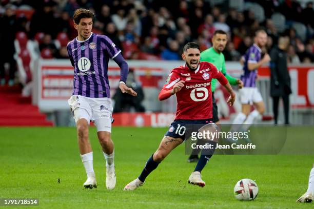 Remy Cabella of Lille, left Stijn Spierings of Toulouse in action during the Ligue 1 Uber Eats match between Lille OSC and Toulouse FC at Stade...
