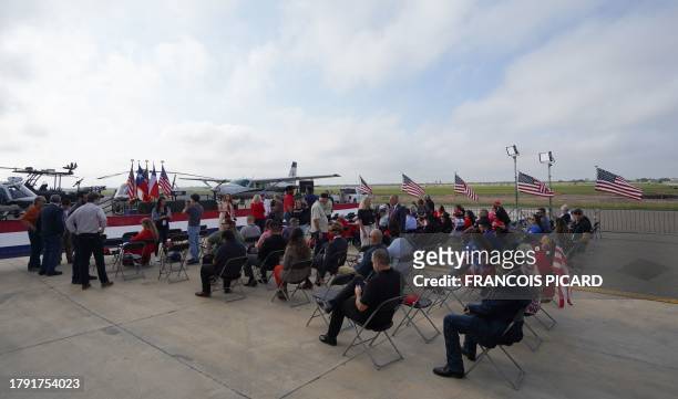 People wait for former President Donald Trump at the South Texas International airport on November 19, 2023 in Edinburg, Texas. Trump and Texas...