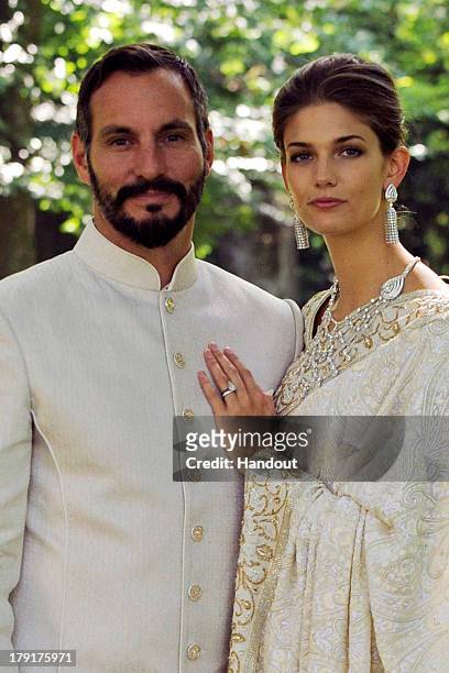 In this handout photo provided by The Ismaili, Prince Rahim Aga Khan and Miss Kendra Salwa Spears pose together during their wedding ceremony on...