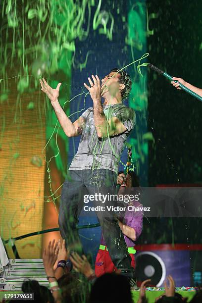 Host Jaime Camil speaks onstage after getting slimed during the Kids Choice Awards Mexico 2013 at Pepsi Center WTC on August 31, 2013 in Mexico City,...