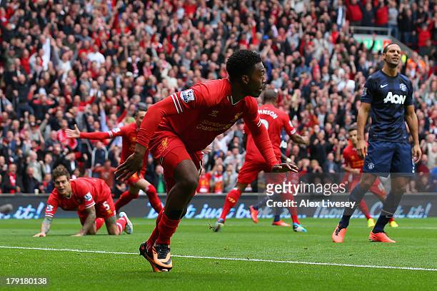 Daniel Sturridge of Liverpool celebrates scoring the opening goal during the Barclays Premier League match between Liverpool and Manchester United at...
