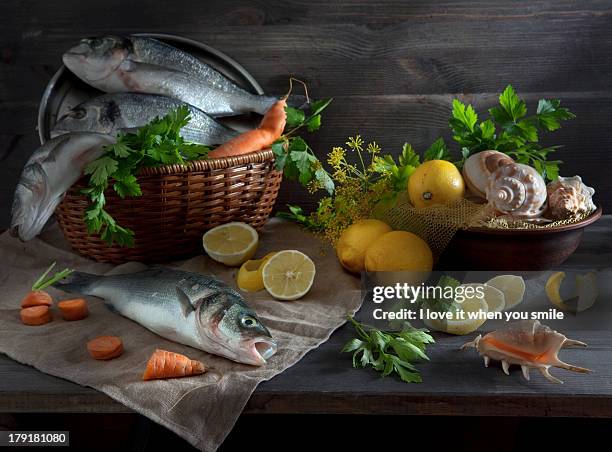 sill life with fish, lemon and shell - fish love stock-fotos und bilder