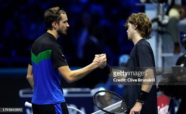 Daniil Medvedev shakes hands with Andrey Rublev following the Men's Singles Round Robin match on day two of the Nitto ATP Finals at Pala Alpitour on...