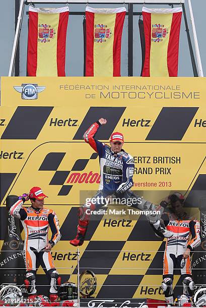 Jorge Lorenzo of Spain and Yamaha Factory Racing in celebrates his race victory on the podium during the Moto GP of Great Britain at Silverstone...