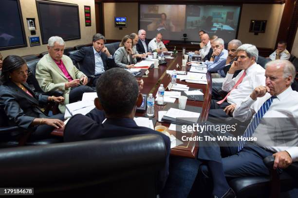In this handout provided by the White House, U.S. President Barack Obama meets in the Situation Room with his national security advisors to discuss...