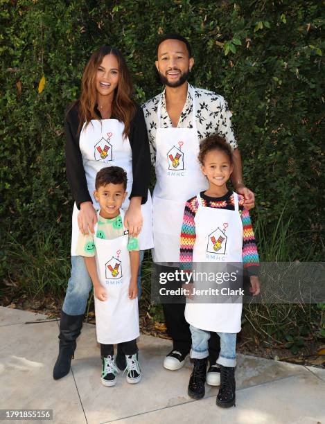 Chrissy Teigen and John Legend with son Miles and daughter Luna as John partners with Ronald McDonald House Charities For The Season Of Giving at...