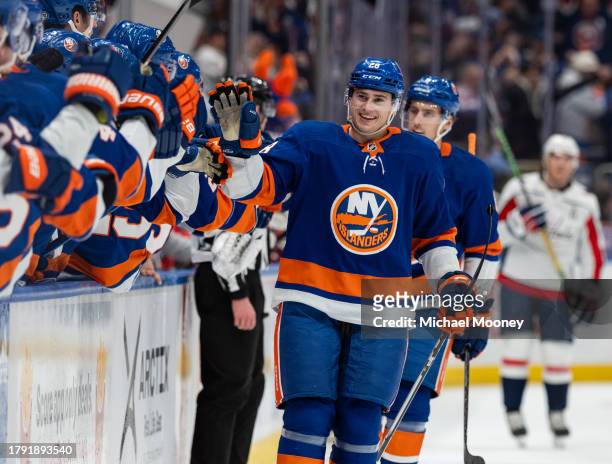Alexander Romanov of the New York Islanders celebrates his first period goal against the Washington Capitals at UBS Arena on November 11, 2023 in...