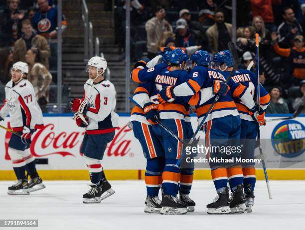 Alexander Romanov of the New York Islanders celebrates his first period goal with teammates during a game against the Washington Capitals at UBS...