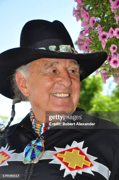 Ben Nighthorse Campbell, a former U.S. Senator representing Colorado, talks with other visitors at the annual Santa Fe Indian Market in Santa Fe, New...