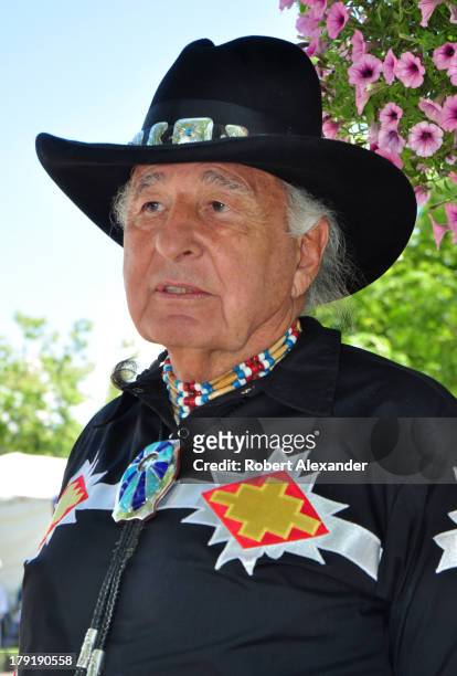 Ben Nighthorse Campbell, a former U.S. Senator representing Colorado, talks with other visitors at the annual Santa Fe Indian Market in Santa Fe, New...