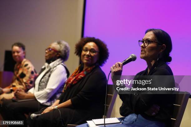 Jackson, MS Shelly C. Lowe, Chair of the National Endowment for the Humanities, far right, speaks to an enthusiastic audience as Monique Davis,...