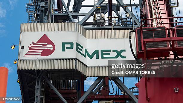 The PEMEX logotype on the tower of the drilling tower of La Muralla IV exploration oil rig, operated by Mexican company "Grupo R" and working for...