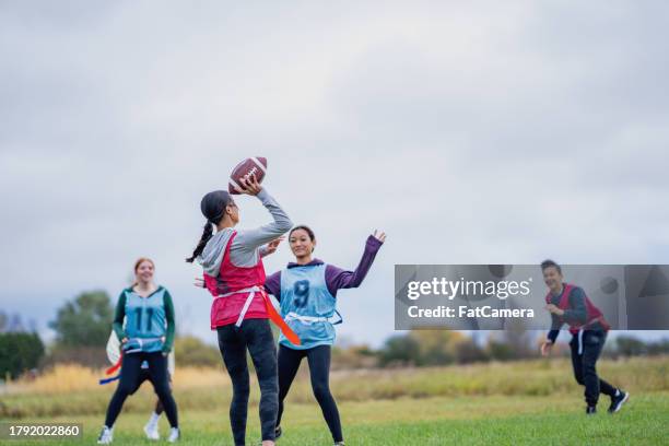 university flag football fun - flag football stock pictures, royalty-free photos & images