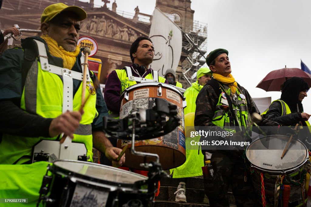 Yellow Vests protesters seen playing percussion instruments...