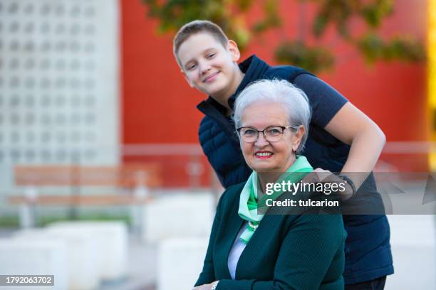 tech-free togetherness: grandson and grandmother in joyful harmony - fashionable grandma stock pictures, royalty-free photos & images