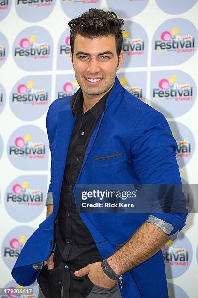 Vocalist Jencarlos Canela poses backstage during Festival People en Español Presented by Target at The Alamodome on August 31, 2013 in San Antonio,...