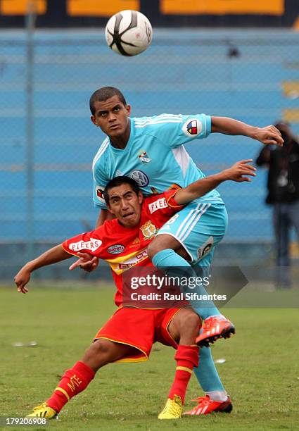 Nelinho Quina of Sporting Cristal fights for the ball with Edson Avila of Sport Huancayo during a match between Sporting Cristal and Sport Huancayo...