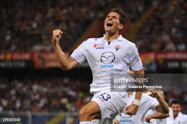 Mario Gomez of ACF Fiorentina celebrates after scoring his team's third goal during the Serie A match between Genoa CFC and ACF Fiorentina at Stadio...
