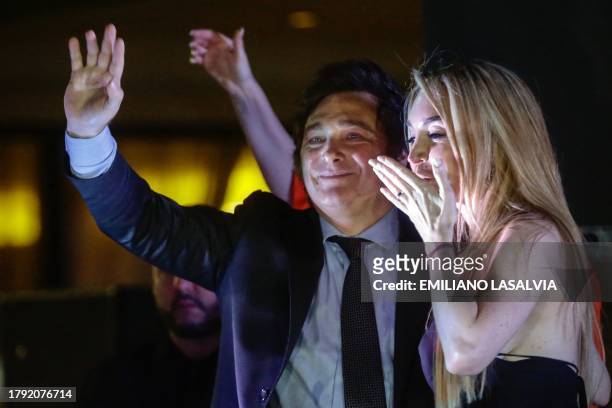 Argentine presidential candidate for the La Libertad Avanza alliance Javier Milei celebrates with his girlfriend Fatima Florez after winning the...