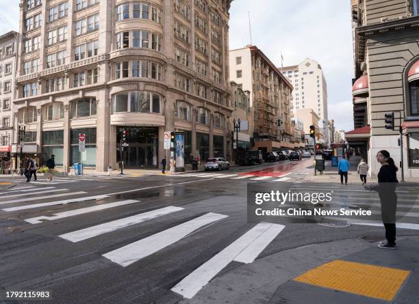 People walk along a clean street near Union Square during the 2023 Asia-Pacific Economic Cooperation Summit on November 13, 2023 in San Francisco,...