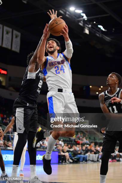 Hunter Maldonado of the Oklahoma City Blue drives to the basket against the Austin spurs on November 19, 2023 at H-E-B Center at Cedar Park Texas....